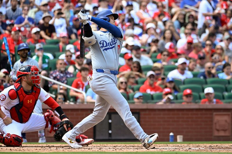 Aug 18, 2024; St. Louis, Missouri, USA; Los Angeles Dodgers designated hitter Shohei Ohtani (17) hits a solo home run against the St. Louis Cardinals in the fifth inning at Busch Stadium. Mandatory Credit: Joe Puetz-USA TODAY Sports