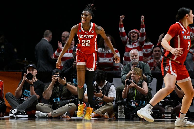 Mar 29, 2024; Portland, OR, USA; NC State Wolfpack guard Saniya Rivers (22) celebrates after scoring a basket during the second half against the Stanford Cardinal in the semifinals of the Portland Regional of the 2024 NCAA Tournament at the Moda Center at the Moda Center. Mandatory Credit: Troy Wayrynen-USA TODAY Sports