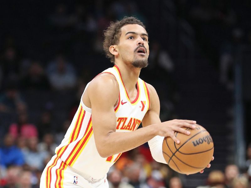 CHARLOTTE, NC - FEBRUARY 14: Trae Young #11 of the Atlanta Hawks handles the ball during the game against the Charlotte Hornets on February 14, 2024 at Spectrum Center in Charlotte, North Carolina. NOTE TO USER: User expressly acknowledges and agrees that, by downloading and or using this photograph, User is consenting to the terms and conditions of the Getty Images License Agreement.  Mandatory Copyright Notice:  Copyright 2024 NBAE (Photo by Brock Williams-Smith/NBAE via Getty Images)