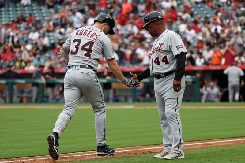Sep 17, 2023; Anaheim, California, USA; Detroit Tigers catcher Jake Rogers (34) is greeted by third base coach Gary Jones (44) after hitting a three-run home run during the third inning against the Los Angeles Angels at Angel Stadium. Mandatory Credit: Kiyoshi Mio-USA TODAY Sports