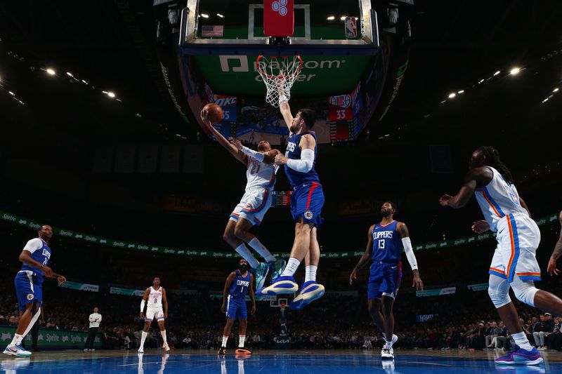 OKLAHOMA CITY, OK - FEBRUARY 22:  Aaron Wiggins #21 of the Oklahoma City Thunder drives to the basket during the game against the LA Clippers on February 22SF, 2024 at Paycom Arena in Oklahoma City, Oklahoma. NOTE TO USER: User expressly acknowledges and agrees that, by downloading and or using this photograph, User is consenting to the terms and conditions of the Getty Images License Agreement. Mandatory Copyright Notice: Copyright 2024 NBAE (Photo by Zach Beeker/NBAE via Getty Images)