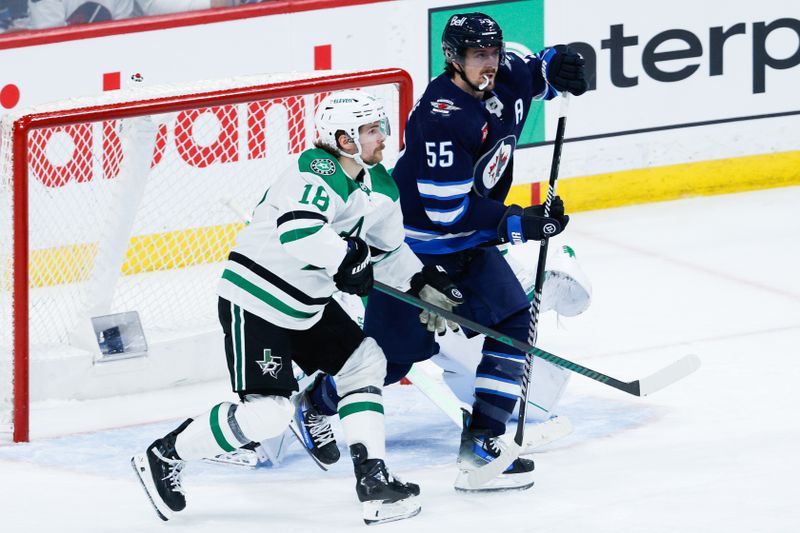 May 7, 2025; Winnipeg, Manitoba, CAN; Dallas Stars forward Joe Pavelski (16) jostles for position with Winnipeg Jets forward Mark Scheifele (55) during the third period in game one of the second round of the 2025 Stanley Cup Playoffs at Canada Life Centre. Mandatory Credit: Terrence Lee-Imagn Images