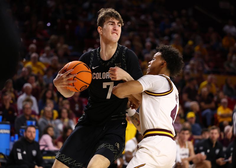 Jan 3, 2026; Tempe, Arizona, USA; Colorado Buffaloes forward Sebastian Rancik (7) controls the ball against Arizona State Sun Devils guard Bryce Ford (4) in the first half at Desert Financial Arena. Mandatory Credit: Mark J. Rebilas-Imagn Images
