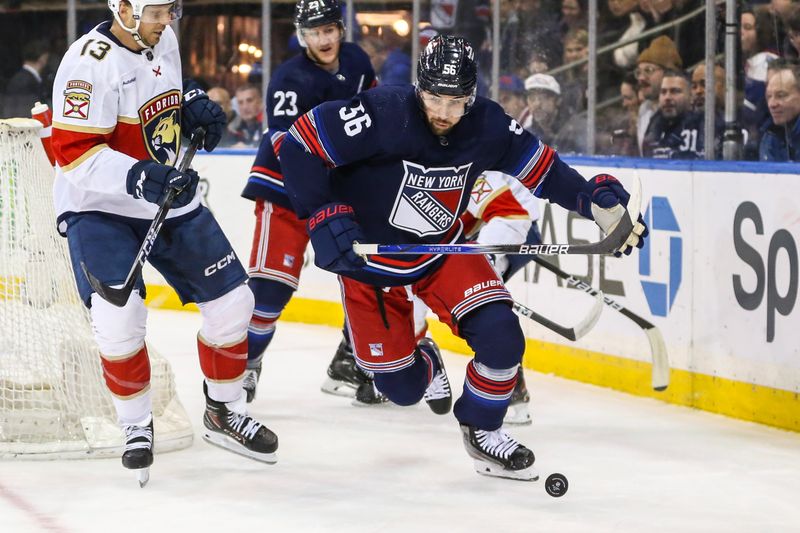 Mar 23, 2024; New York, New York, USA; New York Rangers defenseman Erik Gustafsson (56) chases the puck in the first period against the Florida Panthers at Madison Square Garden. Mandatory Credit: Wendell Cruz-USA TODAY Sports