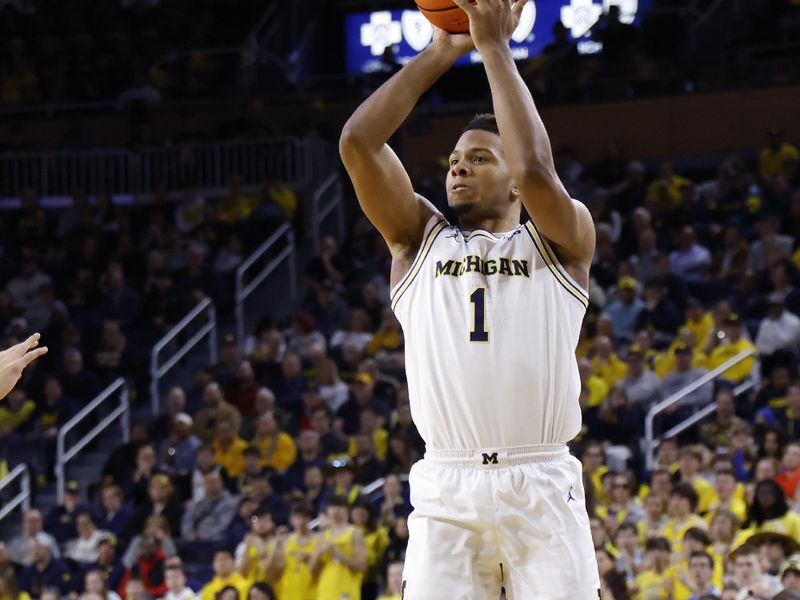 Feb 24, 2026; Ann Arbor, Michigan, USA; Michigan Wolverines guard Trey McKenney (1) shoots in the first half against the Minnesota Golden Gophers at Crisler Center. Mandatory Credit: Rick Osentoski-Imagn Images