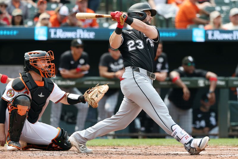 Jun 1, 2025; Baltimore, Maryland, USA; Chicago White Sox outfielder Andrew Benintendi (23) hits a single during the sixth inning against the Baltimore Orioles at Oriole Park at Camden Yards. Mandatory Credit: Daniel Kucin Jr.-Imagn Images