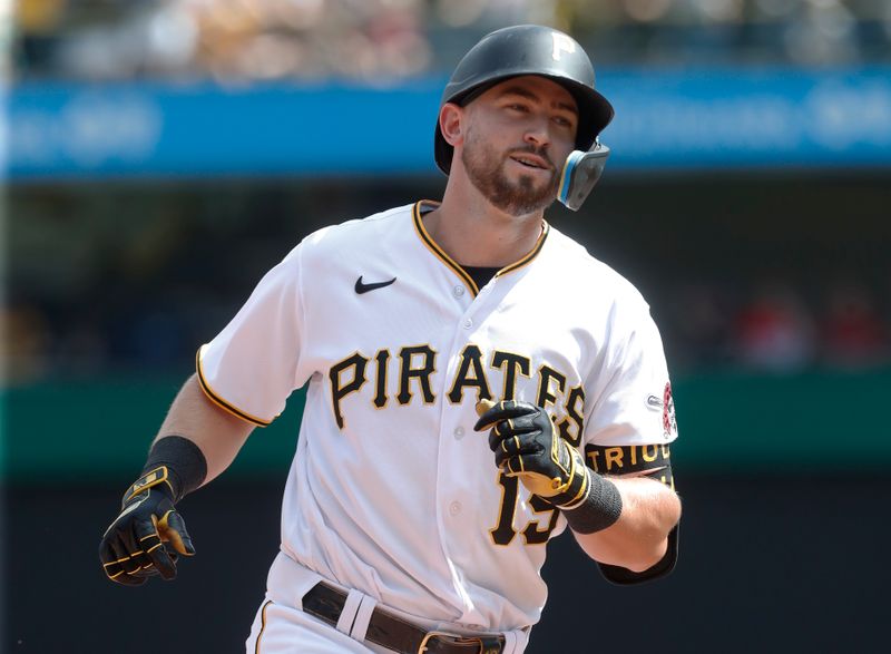 Aug 13, 2023; Pittsburgh, Pennsylvania, USA; Pittsburgh Pirates pinch hitter Jared Triolo (19) circles the bases on a three run home run to record his first major league home run against the Cincinnati Reds during the seventh inning at PNC Park. Mandatory Credit: Charles LeClaire-USA TODAY Sports