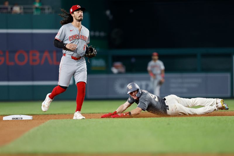 Jul 20, 2024; Washington, District of Columbia, USA; Washington Nationals outfielder Jacob Young (30) steals second base in front of Cincinnati Reds second base Jonathan India (6) during the fourth inning at Nationals Park. Mandatory Credit: Geoff Burke-USA TODAY Sports