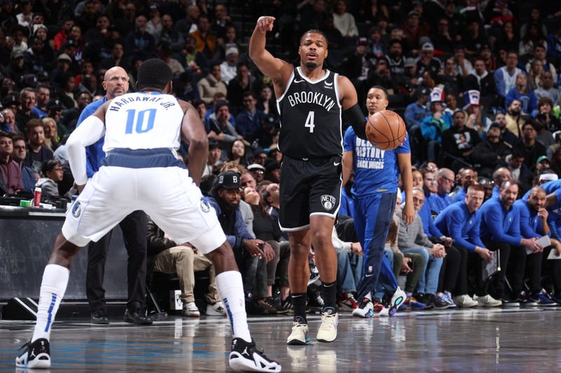 BROOKLYN, NY - FEBRUARY 6: Dennis Smith Jr. #4 of the Brooklyn Nets handles the ball during the game  on February 6, 2024 at Barclays Center in Brooklyn, New York. NOTE TO USER: User expressly acknowledges and agrees that, by downloading and or using this Photograph, user is consenting to the terms and conditions of the Getty Images License Agreement. Mandatory Copyright Notice: Copyright 2024 NBAE (Photo by Nathaniel S. Butler/NBAE via Getty Images)