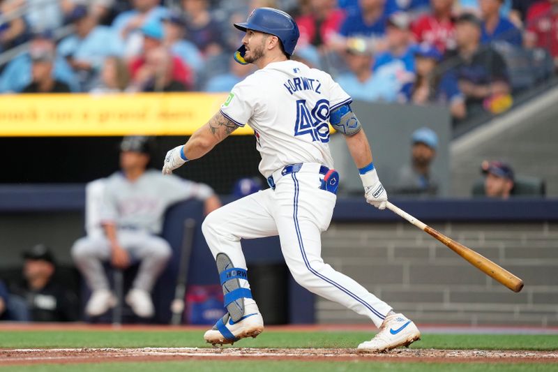 Jul 26, 2024; Toronto, Ontario, CAN; Toronto Blue Jays second baseman Spencer Horwitz (48) hits a two-RBI double against the Texas Rangers during the first inning at Rogers Centre. Mandatory Credit: John E. Sokolowski-USA TODAY Sports