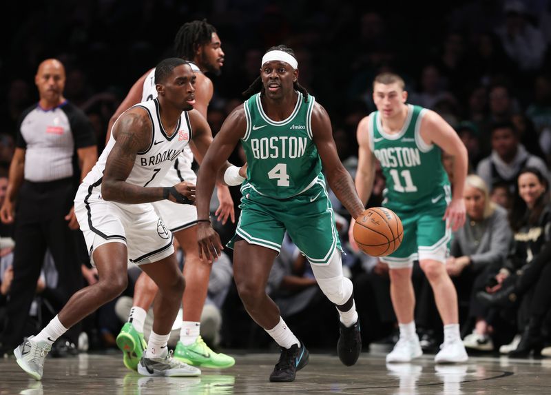 NEW YORK, NEW YORK - NOVEMBER 13: Jrue Holiday #4 of the Boston Celtics drives against Shake Milton #7 of the Brooklyn Nets during the first quarter at Barclays Center on November 13, 2024 in New York City. NOTE TO USER: User expressly acknowledges and agrees that, by downloading and or using this photograph, User is consenting to the terms and conditions of the Getty Images License Agreement.  (Photo by Sarah Stier/Getty Images)