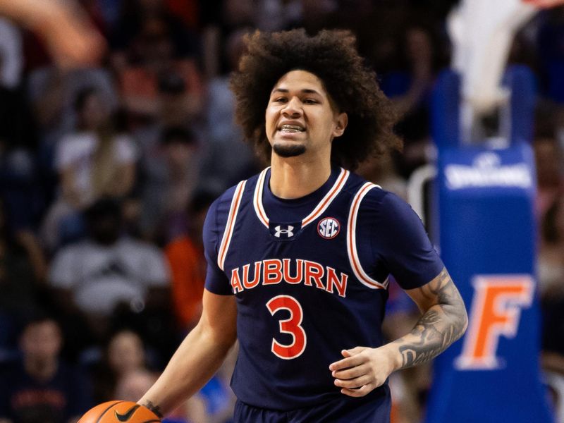 Feb 10, 2024; Gainesville, Florida, USA; Auburn Tigers guard Tre Donaldson (3) dribbles the ball against the Florida Gators during the first half at Exactech Arena at the Stephen C. O'Connell Center. Mandatory Credit: Matt Pendleton-USA TODAY Sports