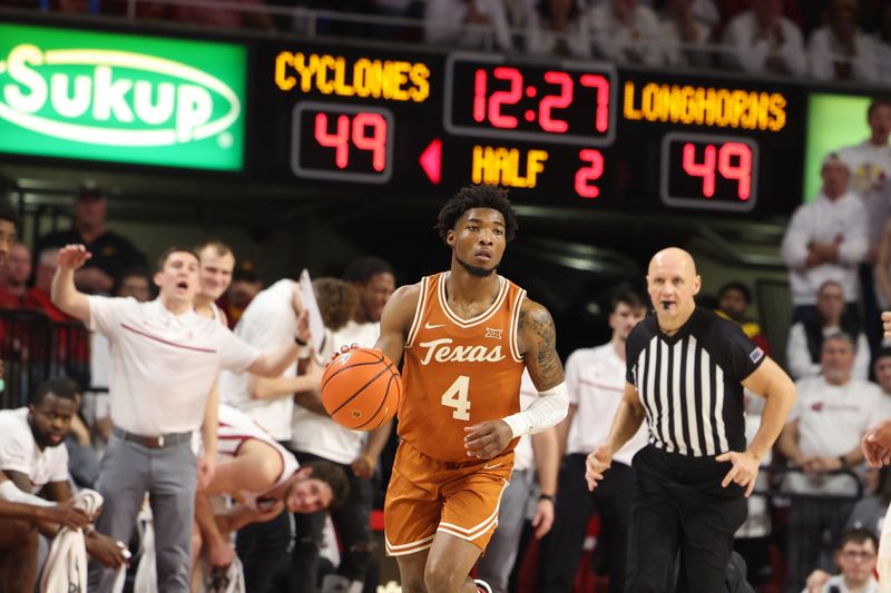 Jan 17, 2023; Ames, Iowa, USA; Texas Longhorns guard Tyrese Hunter (4) dribbles the ball against the Iowa State Cyclones during the second half at James H. Hilton Coliseum. Mandatory Credit: Reese Strickland-USA TODAY Sports