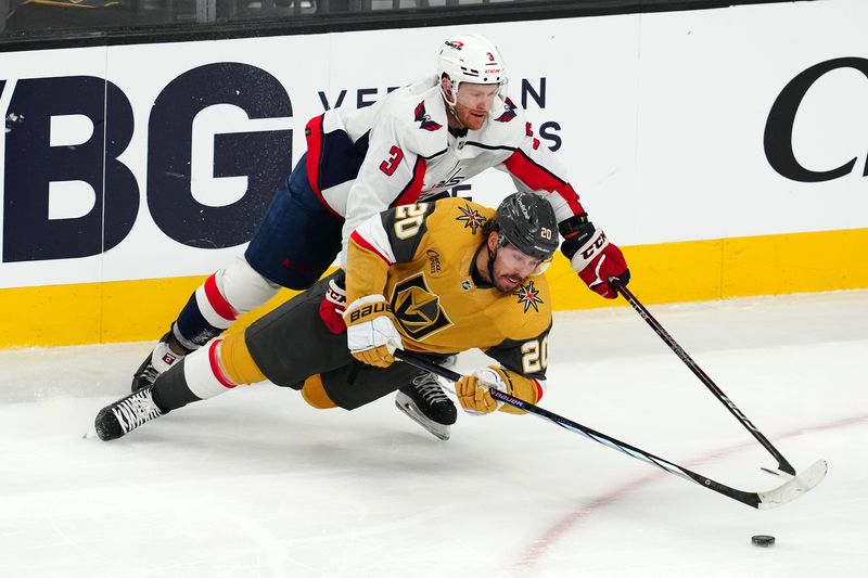 Dec 2, 2023; Las Vegas, Nevada, USA; Vegas Golden Knights center Chandler Stephenson (20) is tripped by Washington Capitals defenseman Nick Jensen (3) during the third period at T-Mobile Arena. Mandatory Credit: Stephen R. Sylvanie-USA TODAY Sports