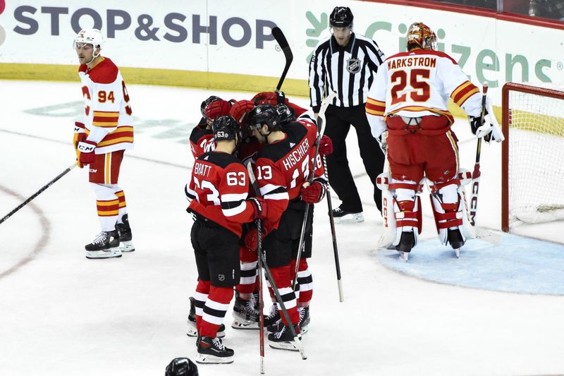 Feb 8, 2024; Newark, New Jersey, USA; New Jersey Devils left wing Ondrej Palat (18) celebrates with teammates after scoring a goal against the Calgary Flames during the third period at Prudential Center. Mandatory Credit: John Jones-USA TODAY Sports