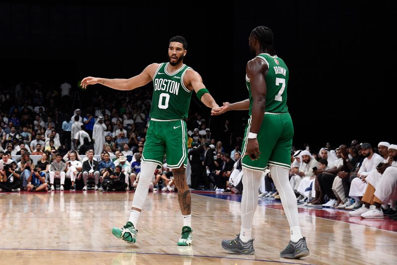 ABU DHABI, UAE - OCTOBER 6: Jayson Tatum #0 and Jaylen Brown #7 of the Boston Celtics high five during the game against the Denver Nuggets during the 2024 Global Games on October 6, 2024 at the Etihad Arena in Abu Dhabi, United Arab Emirates. NOTE TO USER: User expressly acknowledges and agrees that, by downloading and/or using this Photograph, user is consenting to the terms and conditions of the Getty Images License Agreement. Mandatory Copyright Notice: Copyright 2024 NBAE (Photo by Brian Babineau/NBAE via Getty Images)