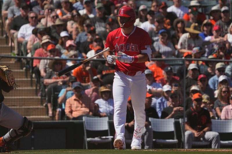 Mar 20, 2024; Tempe, Arizona, USA; Los Angeles Angels center fielder Mike Trout (27) draws a walk against the San Francisco Giants in the first inning at Tempe Diablo Stadium. Mandatory Credit: Rick Scuteri-USA TODAY Sports