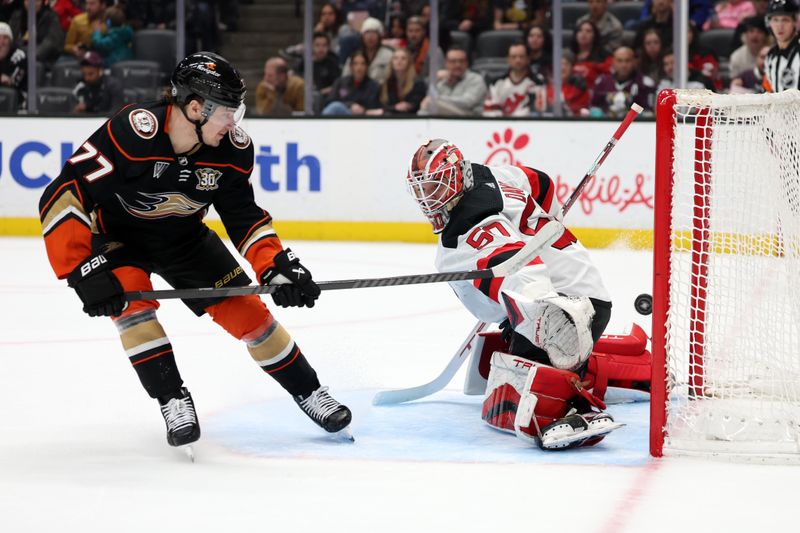 Mar 1, 2024; Anaheim, California, USA; New Jersey Devils goaltender Nico Daws (50) gives up a goal against Anaheim Ducks right wing Frank Vatrano (77) during the second period at Honda Center. Mandatory Credit: Kiyoshi Mio-USA TODAY Sports