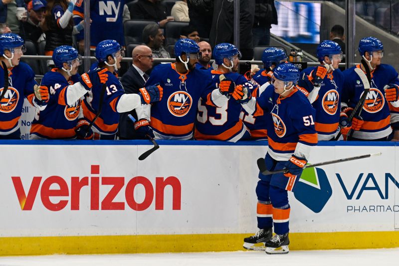 Oct 23, 2025; Elmont, New York, USA;  New York Islanders left wing Emil Heineman (51) celebrates his goal against the Detroit Red Wings during the third period at UBS Arena. Mandatory Credit: Dennis Schneidler-Imagn Images