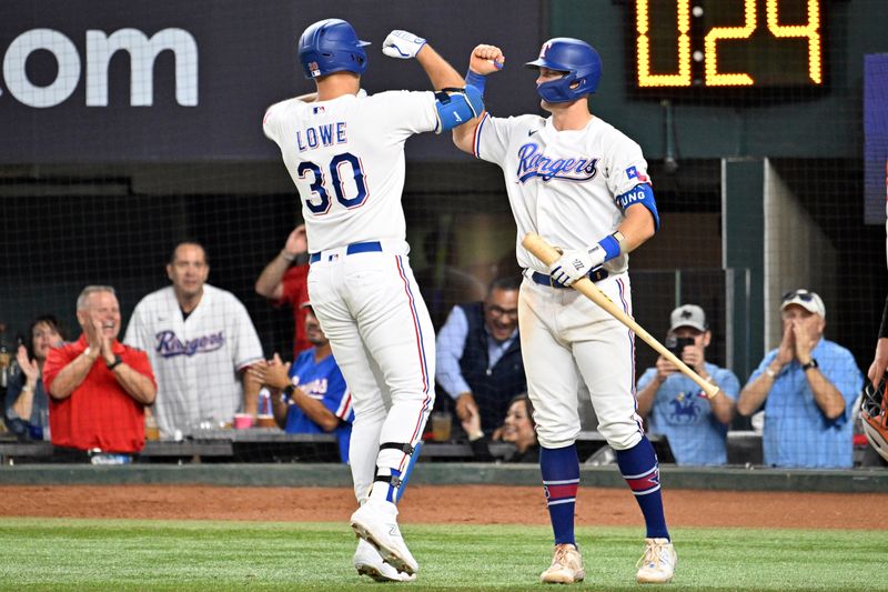 Oct 10, 2023; Arlington, Texas, USA; Texas Rangers first baseman Nathaniel Lowe (30) celebrates with third baseman Josh Jung (6) after hitting a solo home run in the sixth inning against the Baltimore Orioles during game three of the ALDS for the 2023 MLB playoffs at Globe Life Field. Mandatory Credit: Jerome Miron-USA TODAY Sports