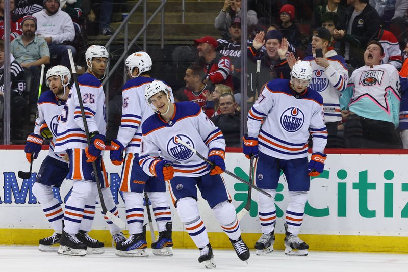 Dec 21, 2023; Newark, New Jersey, USA; Edmonton Oilers center Ryan McLeod (71) celebrates his goal against the New Jersey Devils during the third period at Prudential Center. Mandatory Credit: Ed Mulholland-USA TODAY Sports