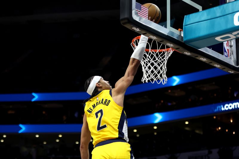 CHARLOTTE, NORTH CAROLINA - FEBRUARY 12: Andrew Nembhard #2 of the Indiana Pacers lays the ball up during the second half of an NBA game against the Charlotte Hornets at Spectrum Center on February 12, 2024 in Charlotte, North Carolina. NOTE TO USER: User expressly acknowledges and agrees that, by downloading and or using this photograph, User is consenting to the terms and conditions of the Getty Images License Agreement. (Photo by David Jensen/Getty Images)