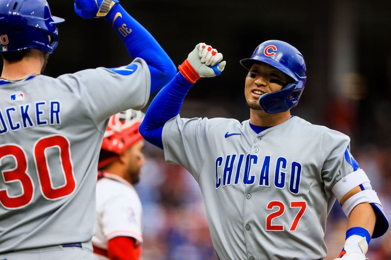 May 25, 2025; Cincinnati, Ohio, USA; Chicago Cubs designated hitter Seiya Suzuki (27) reacts with outfielder Kyle Tucker (30) after hitting a three-run home run in the eighth inning against the Cincinnati Reds at Great American Ball Park. Mandatory Credit: Katie Stratman-Imagn Images