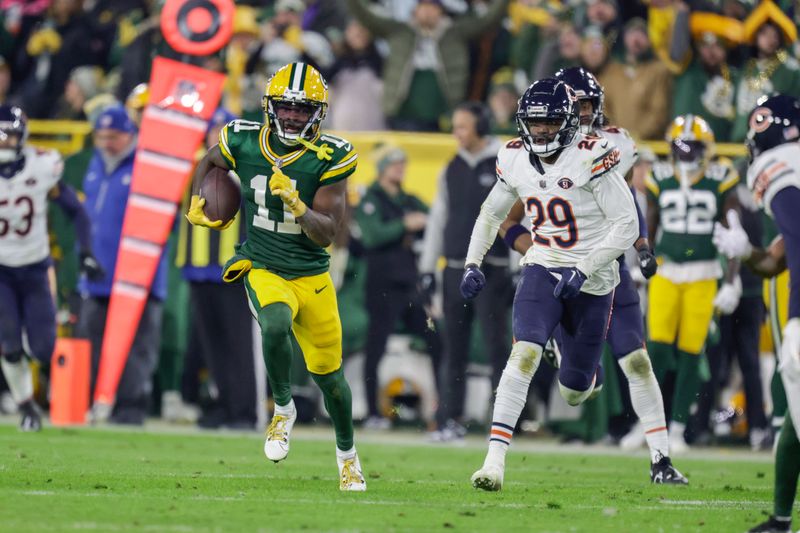 Green Bay Packers wide receiver Jayden Reed (11) runs after making a catch during an NFL football game between the Green Bay Packers and Chicago Bears Sunday, Jan. 7, 2024, in Green Bay, Wis. (AP Photo/Matt Ludtke)