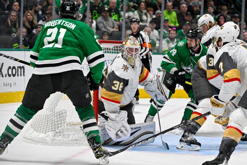 Dec 9, 2023; Dallas, Texas, USA; Vegas Golden Knights goaltender Logan Thompson (36) faces a shot by Dallas Stars left wing Jason Robertson (21) and left wing Jamie Benn (14) during the second period at the American Airlines Center. Mandatory Credit: Jerome Miron-USA TODAY Sports