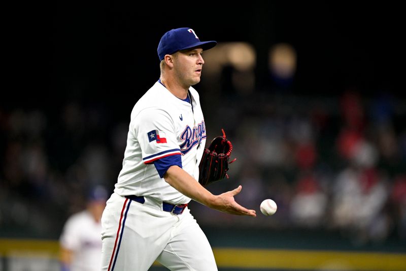 Aug 23, 2025; Arlington, Texas, USA; Texas Rangers relief pitcher Jacob Webb (71) fields a ground ball hit by Cleveland Guardians first baseman Kyle Manzardo (not pictured) to end the game at Globe Life Field. Mandatory Credit: Jerome Miron-Imagn Images