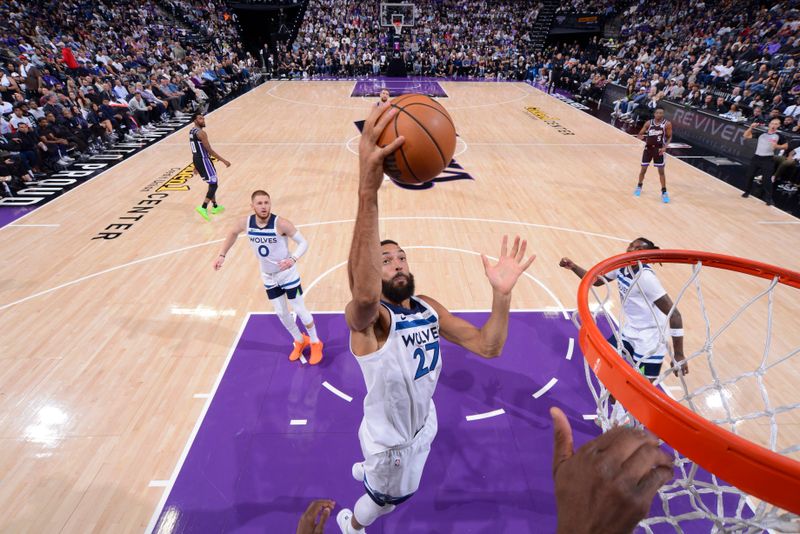 SACRAMENTO, CA - OCTOBER 24: Rudy Gobert #27 of the Minnesota Timberwolves rebounds the ball during the game against the Sacramento Kings on October 24, 2024 at Golden 1 Center in Sacramento, California. NOTE TO USER: User expressly acknowledges and agrees that, by downloading and or using this Photograph, user is consenting to the terms and conditions of the Getty Images License Agreement. Mandatory Copyright Notice: Copyright 2024 NBAE (Photo by Rocky Widner/NBAE via Getty Images)