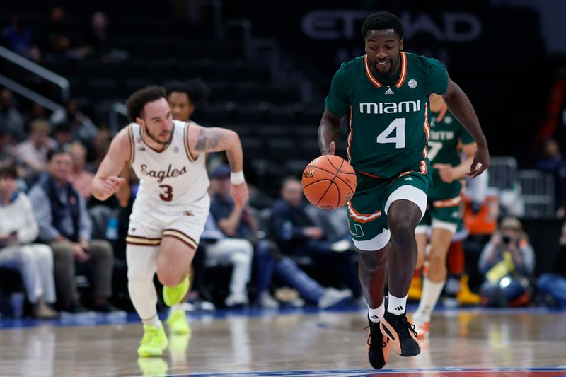 Mar 12, 2024; Washington, D.C., USA; Miami (Fl) Hurricanes guard Bensley Joseph (4) dribbles the ball as Boston College Eagles guard Jaeden Zackery (3) chases in the first half at Capital One Arena. Mandatory Credit: Geoff Burke-USA TODAY Sports