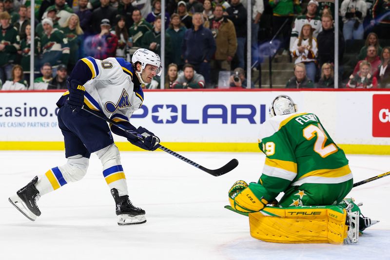 Mar 23, 2024; Saint Paul, Minnesota, USA; St. Louis Blues left wing Brandon Saad (20) scores the game winning goal passes Minnesota Wild goaltender Marc-Andre Fleury (29) during overtime at Xcel Energy Center. Mandatory Credit: Matt Krohn-USA TODAY Sports