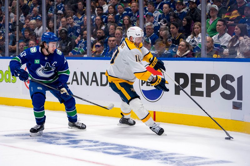 Apr 23, 2024; Vancouver, British Columbia, CAN; Vancouver Canucks defenseman Quinn Hughes (43) defends against Nashville Predators forward Colton Sissons (10) during the second period in game two of the first round of the 2024 Stanley Cup Playoffs at Rogers Arena. Mandatory Credit: Bob Frid-USA TODAY Sports