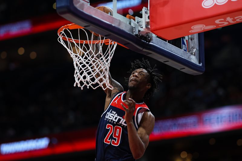 WASHINGTON, DC - APRIL 09: Quenton Jackson #29 of the Washington Wizards dunks the ball against the Houston Rockets during the second half at Capital One Arena on April 9, 2023 in Washington, DC. NOTE TO USER: User expressly acknowledges and agrees that, by downloading and or using this photograph, User is consenting to the terms and conditions of the Getty Images License Agreement. (Photo by Scott Taetsch/Getty Images)