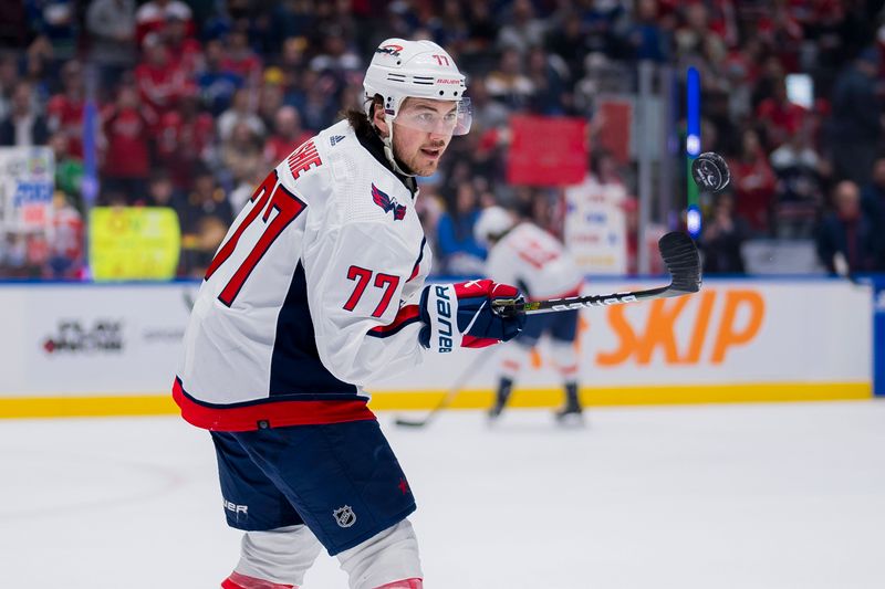 Mar 16, 2024; Vancouver, British Columbia, CAN; Washington Capitals forward TJ Oshie (77) handles the puck during warm up prior to a game against the Vancouver Canucks at Rogers Arena.  Mandatory Credit: Bob Frid-USA TODAY Sports