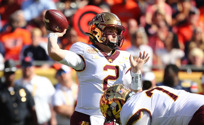 Jan 1, 2020; Tampa, Florida, USA; Minnesota Golden Gophers quarterback Tanner Morgan (2) throws the ball against the Auburn Tigers during the first quarter at Raymond James Stadium. Mandatory Credit: Kim Klement-USA TODAY Sports