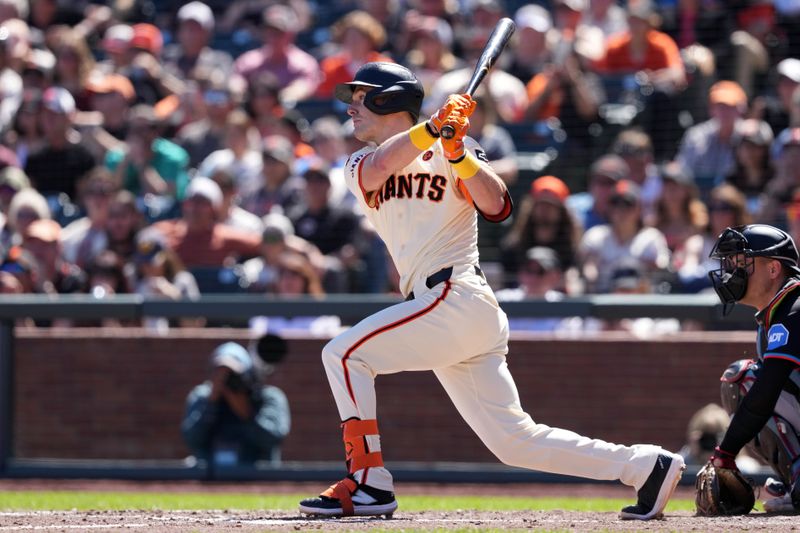 Sep 1, 2024; San Francisco, California, USA; San Francisco Giants pinch hitter Mark Canha (16) hits an RBI single against the Miami Marlins during the fifth inning at Oracle Park. Mandatory Credit: Darren Yamashita-USA TODAY Sports