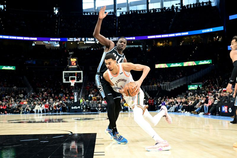 ATLANTA, GA - JANUARY 15: Victor Wembanyama #1 of the San Antonio Spurs drives to the basket during the game against the Atlanta Hawks on January 15, 2024 at State Farm Arena in Atlanta, Georgia.  NOTE TO USER: User expressly acknowledges and agrees that, by downloading and/or using this Photograph, user is consenting to the terms and conditions of the Getty Images License Agreement. Mandatory Copyright Notice: Copyright 2024 NBAE (Photo by Adam Hagy/NBAE via Getty Images)