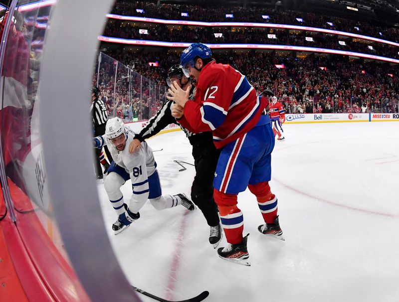 Nov 22, 2025; Montreal, Quebec, CAN; Montreal Canadiens defenseman Arber Xhekaj (72) fights Toronto Maple Leafs forward Dakota Joshua (81) after the game at the Bell Centre. Mandatory Credit: Eric Bolte-Imagn Images