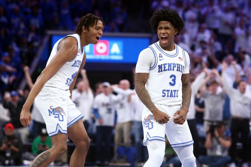 Mar 5, 2023; Memphis, Tennessee, USA; Memphis Tigers forward Chandler Lawson (4) and guard Kendric Davis (3) react during the second half against the Houston Cougars at FedExForum. Mandatory Credit: Petre Thomas-USA TODAY Sports