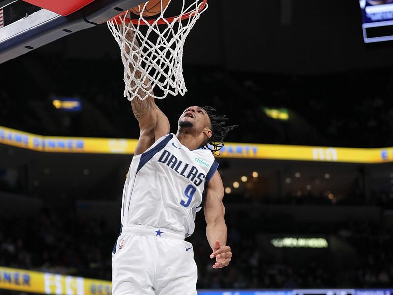 MEMPHIS, TENNESSEE - DECEMBER 11: A.J. Lawson #9 of the Dallas Mavericks goes to the basket during the first half against the Memphis Grizzlies at FedExForum on December 11, 2023 in Memphis, Tennessee. NOTE TO USER: User expressly acknowledges and agrees that, by downloading and or using this photograph, User is consenting to the terms and conditions of the Getty Images License Agreement.  (Photo by Justin Ford/Getty Images)