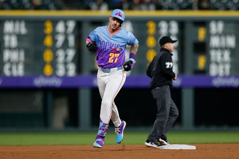 May 9, 2025; Denver, Colorado, USA; Colorado Rockies left fielder Jordan Beck (27) rounds the bases on a solo home run in the eighth inning against the San Diego Padres at Coors Field. Mandatory Credit: Isaiah J. Downing-Imagn Images