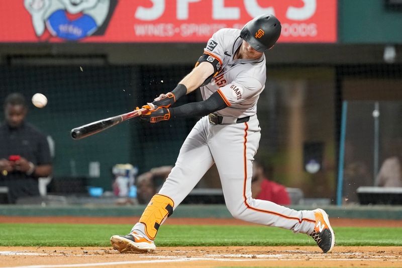 Jun 7, 2024; Arlington, Texas, USA; San Francisco Giants right fielder Mike Yastrzemski (5) connects for a single against the Texas Rangers during the second inning at Globe Life Field. Mandatory Credit: Jim Cowsert-USA TODAY Sports