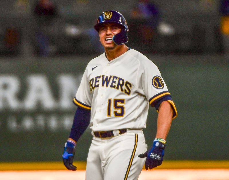 Apr 17, 2022; Milwaukee, Wisconsin, USA;  Milwaukee Brewers center fielder Tyrone Taylor (15) reacts after hitting a double to drive in 2 runs in the seventh inning against the St. Louis Cardinals at American Family Field. Mandatory Credit: Benny Sieu-USA TODAY Sports