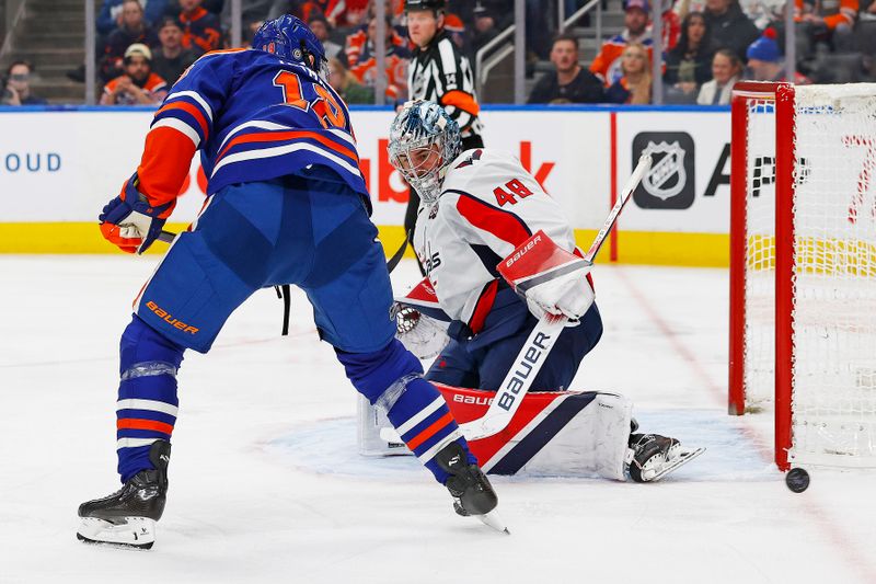 Jan 21, 2025; Edmonton, Alberta, CAN; Washington Capitals goaltender Logan Thompson (48) makes a save on Edmonton Oilers forward Zach Hyman (18) during the third period at Rogers Place. Mandatory Credit: Perry Nelson-Imagn Images