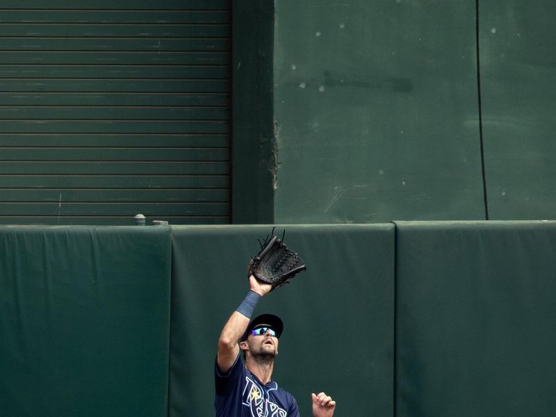 Aug 22, 2024; Oakland, California, USA; Tampa Bay Rays center fielder Kameron Misner (26) makes the catch of a sacrifice fly by Oakland Athletics second baseman Zack Gelof during the second inning at Oakland-Alameda County Coliseum. Mandatory Credit: D. Ross Cameron-USA TODAY Sports
