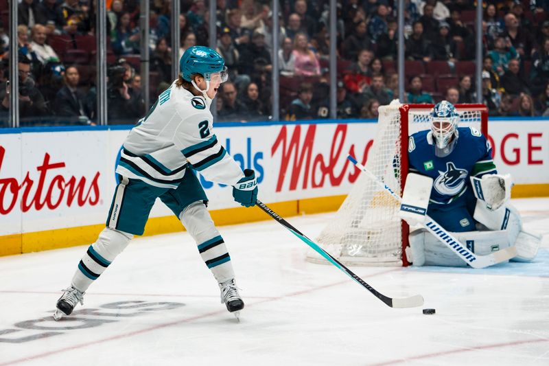 Jan 27, 2026; Vancouver, British Columbia, CAN; San Jose Sharks forward Will Smith (2) handles the puck against the Vancouver Canucks in the first period at Rogers Arena. Mandatory Credit: Bob Frid-Imagn Images