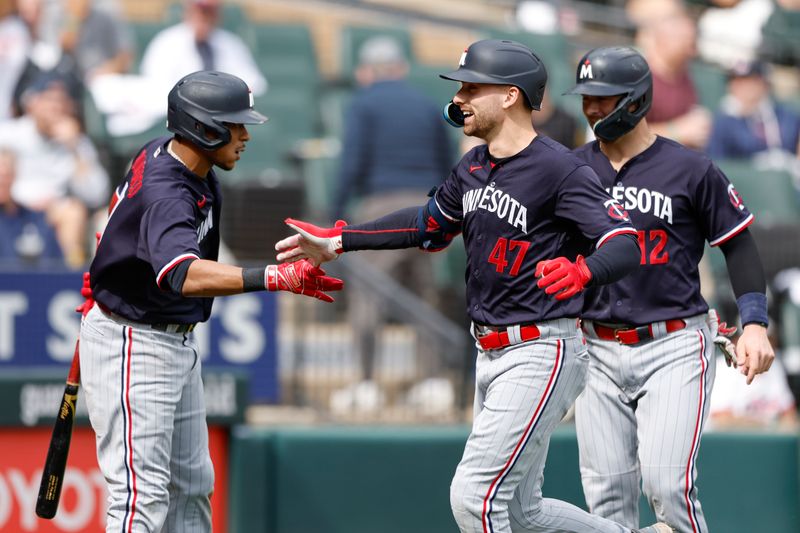 Sep 17, 2023; Chicago, Illinois, USA; Minnesota Twins second baseman Edouard Julien (47) celebrates with second baseman Jorge Polanco (11) after hitting a three-run home run against the Chicago White Sox during the fifth inning at Guaranteed Rate Field. Mandatory Credit: Kamil Krzaczynski-USA TODAY Sports