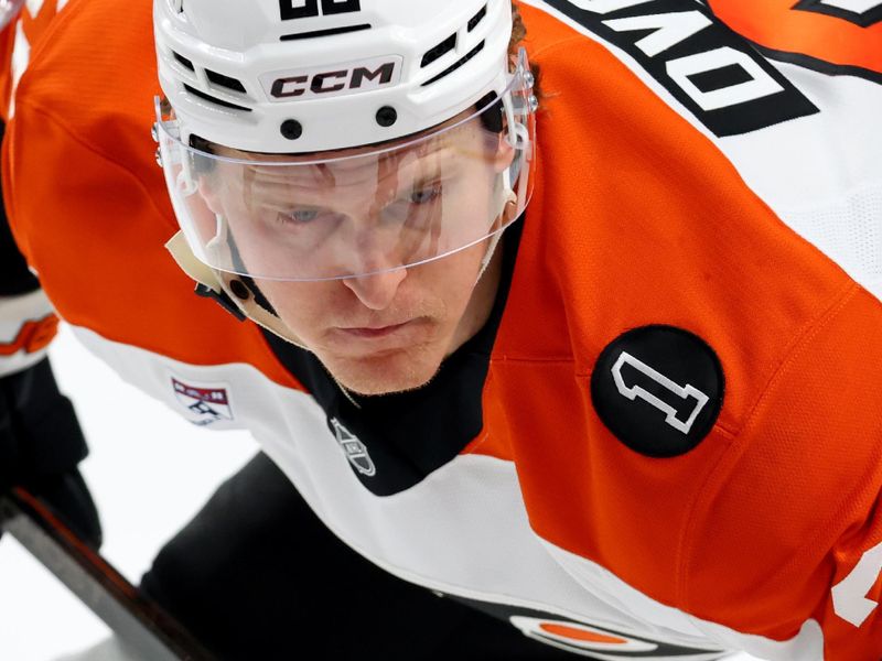 Dec 18, 2025; Buffalo, New York, USA;  Philadelphia Flyers center Christian Dvorak (22) waits for the linesman to drop the puck for a face-off during the first period against the Buffalo Sabres at KeyBank Center. Mandatory Credit: Timothy T. Ludwig-Imagn Images